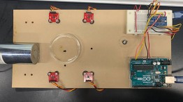 Experimental setup of magnetometer array for the localization of a ferrofluid droplet, from Skylar Eiskowitz's capstone project.