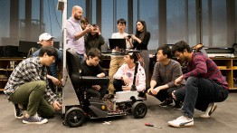 Professors Luchtenburg, Shah, and Shlayan working with students on the autonomous and connected systems projects 