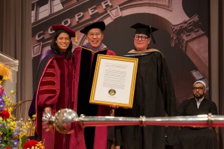 President Sparks and Trustee Robert Tan presented the presidential citation that was awarded to Professor Diane Lewis, who passed away earlier this month. The architect Merrill Elam accepted on Professor Lewis' behalf.