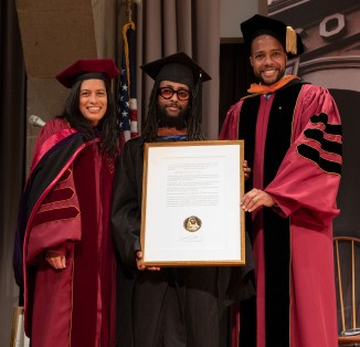 Recipient of a Presidential Citation Awol Erizku A'10, center, with Laura Sparks and Malcolm King, of the Board of Trustees