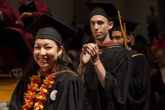 School of Art graduates Julie Harris and Micah Hesse await their diplomas