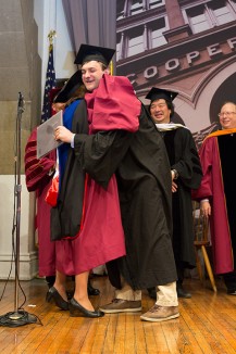 Joseph Zwetchkenbaum CE'24 gets a big hug from Dean Teresa Dahlberg after he corrects the pronounciation of his name