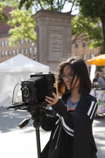 Photographer using a large-format camera at the Astor Alive! festival