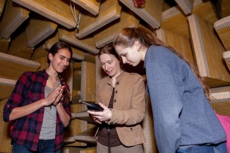 Prof. Melody Baglione shows students Cooper's anechoic chamber, the only one in New York City. 