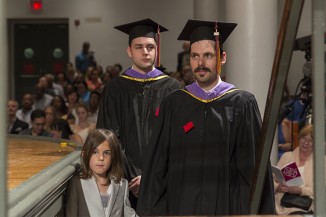Christopher M. Taleff AR'15 with his son, Bannack, at his side. Brandon J. Todder AR'15 waits behind.