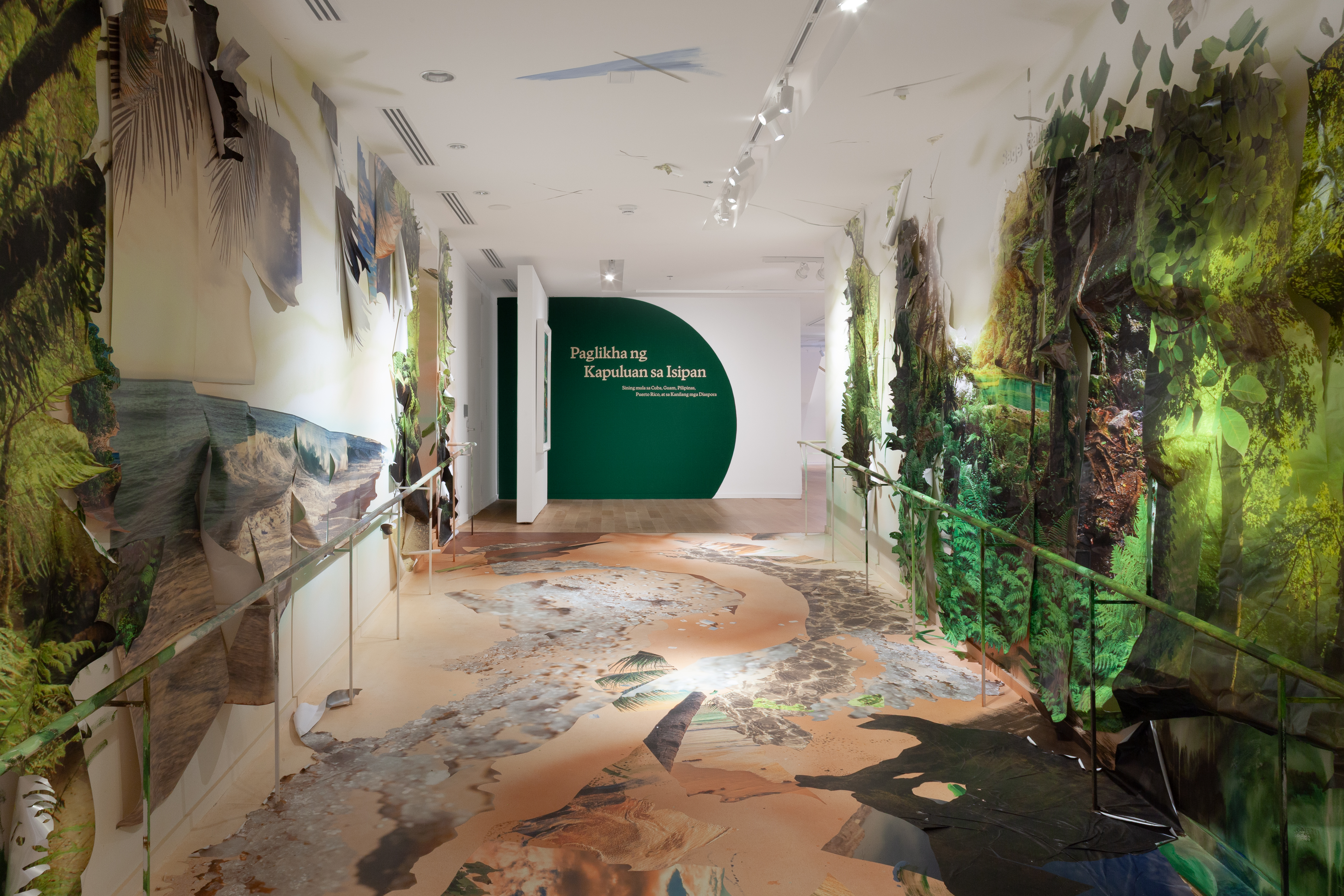 Image credit: Tabi tabi po (with respect) a pardon for our ways, 2026. Site-specific commission for Imagining an Archipelago: Art from Cuba, Guam, the Philippines, Puerto Rico, and Their Diasporas, Colby Museum of Art. Watercolor, acrylic, tropical landscape stock vinyl, reproduction of Charles Codman's The Forest Near Portland, Maine, and photographs of salt from the Philippines and the Americas, with photographs created in collaboration with Andre Taylor.