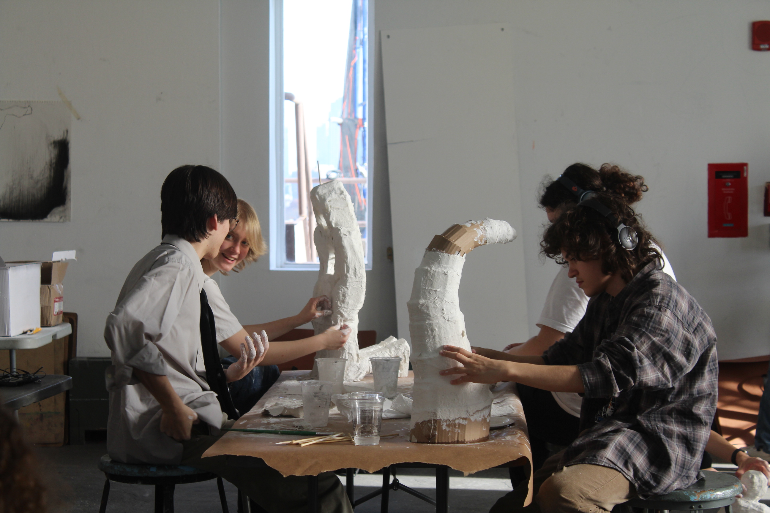 Portfolio Pre students working on sculptures.