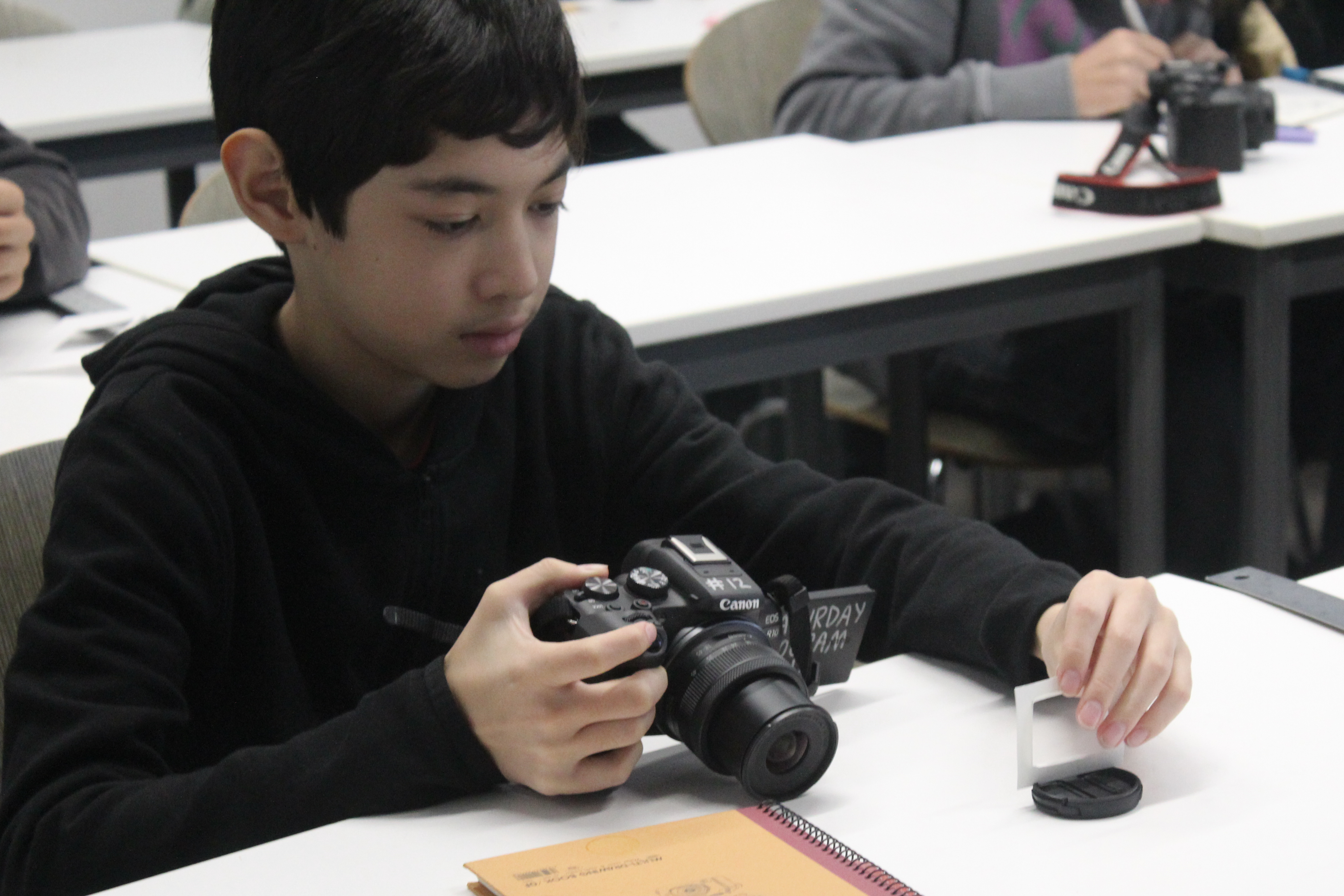 Student exploring their camera in the Media Production class.