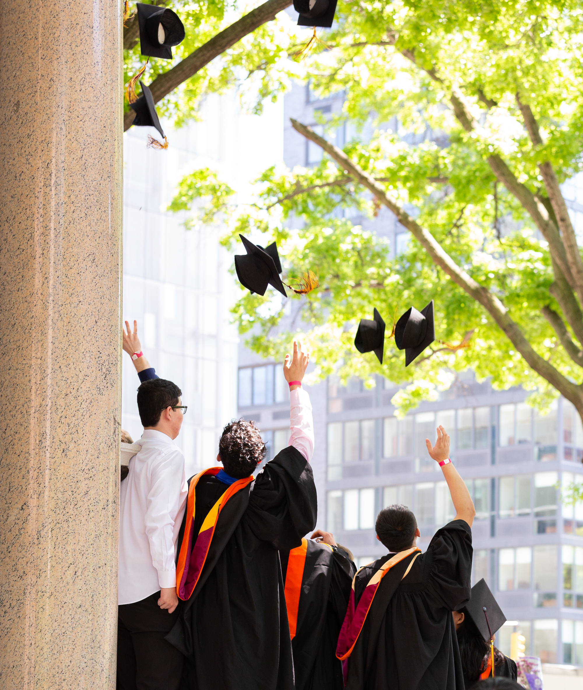 Class of 2024 throw their caps in the air to celebrate