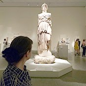 Mary Stieber views the cult statue of Athena from Pergamum at the Metropolitan Museum of Art. Photo by Katherine Leu