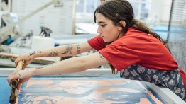 student working on a silk screen