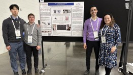 students in front of ASME poster
