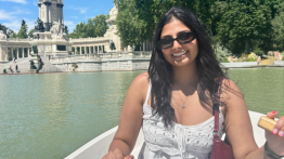 Isha Dave ChE'26 at El Retiro Park rowing a boat in the pond.