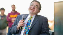 Man in colorful tie laughing