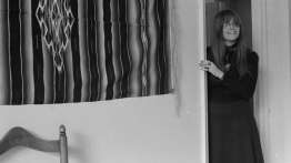A self-portrait by Marcia Resnick, who stands in doorway