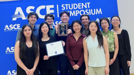 Group of students hold first place prize
