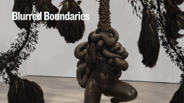 A dark, hanging sculpture