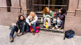 students on the stoop of the foundation building