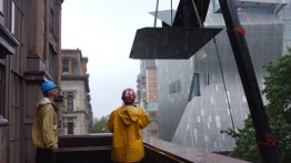 "The Glider" being installed on to the Cooper Union Foundation Building