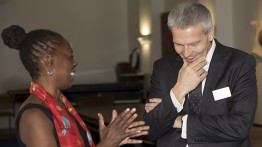NYC First Lady Chirlane McCray, who spoke before the mayor, shares a light moment with Acting President Bill Mea