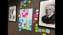 Using Post-It notes to brainstorm ideas in the Menschel Board Room 