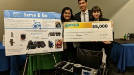 Kavya Udupa, Billy Dayan, and Morgan Wolfe with their winning design for a wheelchair that let's a restaurant worker do her job more effectively.