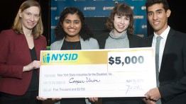 Professor Melody Baglione and seniors Kavya Udupa, Morgan Wolfe, and Billy Dayan at the CREATE Symposium after winning third place in a competition to create technology for workers with disabilities.  Isabella Pestovski (not pictured) was also a member of