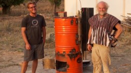 Julien Caubel (ME'2011) and Prof. Toby Cumberbatch next to a prototype steam engine built from scrap metal