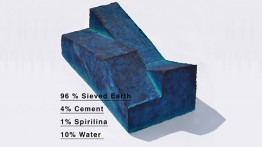 One of Max's pressed earthen bricks. Spirulina is an algae that gives the brick is cerulean hue