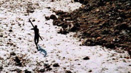 A member of the Sentinelese tribe firing an arrow at a helicopter © Indian Coastguard
