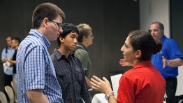 NASA recruiters chat with students after the presentation