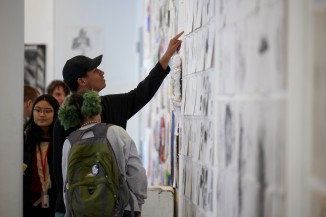 Students viewing artwork at the Year End Show