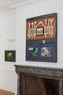 Installation image of a painting over fireplace