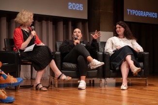 Three on stage in conversation