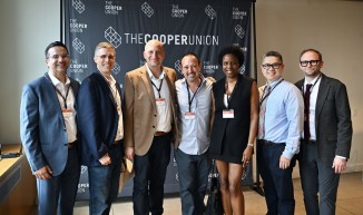 a group of seven people in front of a Cooper Union sign