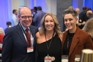 a man and two women at a party