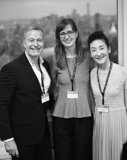 a man and two women in black and white