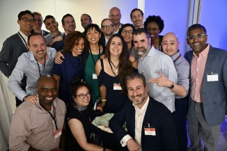 a large group of friends pose at a party