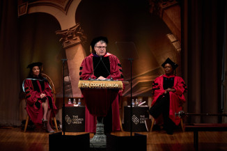 Man in regalia at lectern