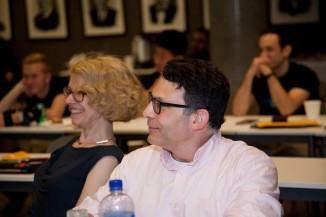 Judges Ellen Lupton A’85 and Barry Negrin ME’89 listen to student inventors