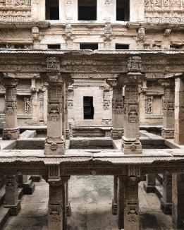 The structural elements of the Queen's Stepwell, including beams, capitals, column shafts, and pedestals, are decorated with vegetal and figural motifs.