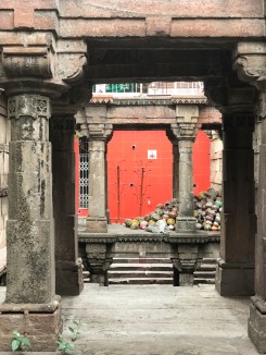 In the Ashapura maata vaav, the first pavilion of the stepwell has been converted to a temple and covered by bright red tiles, while the rest of the structure remains untouched. The pots piled in the gallery are used by women in their temple rituals. 