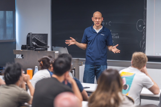 A guest speaker addresses Cooper Union students in a classroom.
