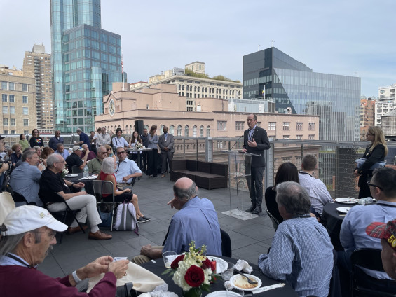 Guests gather at a Cooper Union rooftop reception overlooking the city.