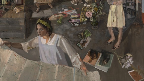 Detail of a painting showing a woman in a white blouse leaning over a large sheet with lines, surrounded by scattered books and flowers, with part of another figure visible nearby.