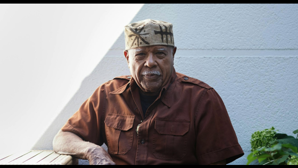 Portrait of Edwards in a brown shirt