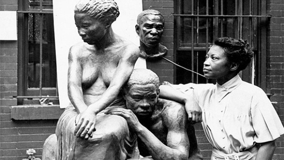 Augusta Savage posing with her sculpture Realization, created as part of the Works Progress Administration's Federal Art Project. ca. 1938. Photo by Andrew Herman